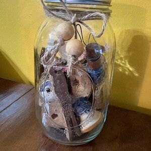 Ball Mason Jar full of vintage wood spools & clothespins